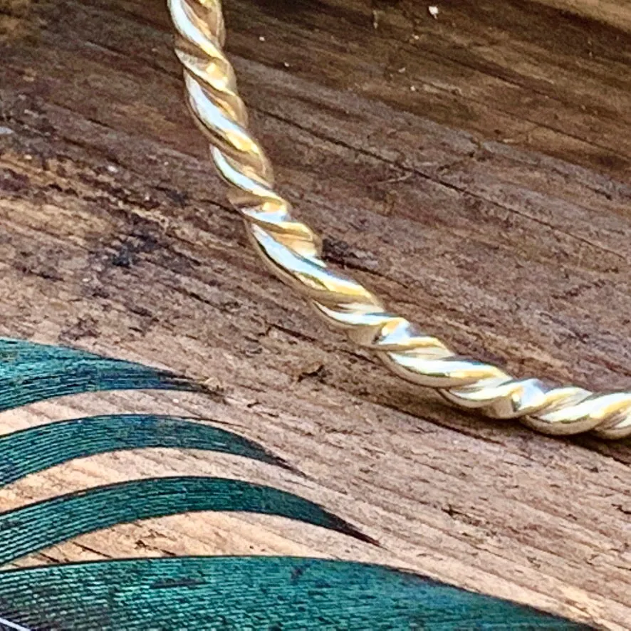 Sterling silver twisted bangle. M/L